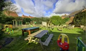 The outdoor area of the Wombourne Pool Bar, with a large beer garden that catches the sun.