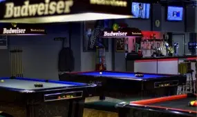Pool Tables with Budweiser lights.
