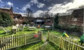 The outdoor beer garden of the pool bar with safe childrens play area.